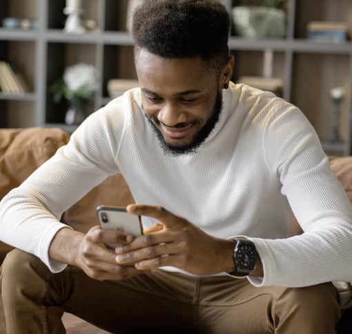 A man texting on his phone.