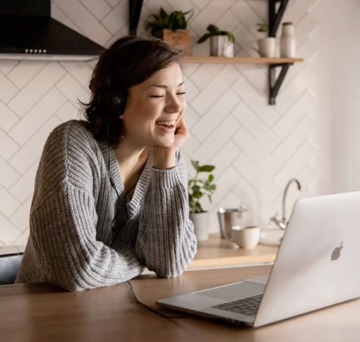 A woman in a video call on her laptop.