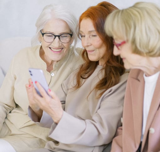 A group of individuals in a video chat on a phone.